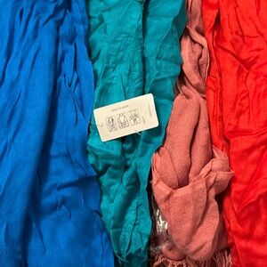 4 Pashtuns scarves re, pink, teal and blue. All new. Only one has a bag.